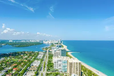 an aerial view of a beach with buildings and the ocean at PRAIA Hotel Boutique & Apartments Miami Beach in Miami Beach