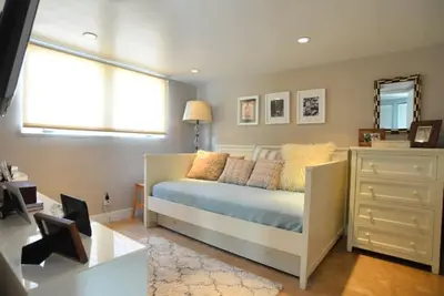 a bedroom with a bed and a window and a dresser at Villa Naomi - Luxury Design New Home in Miami