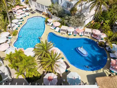 an overhead view of a swimming pool at a resort at The Savoy Hotel & Beach Club in Miami Beach