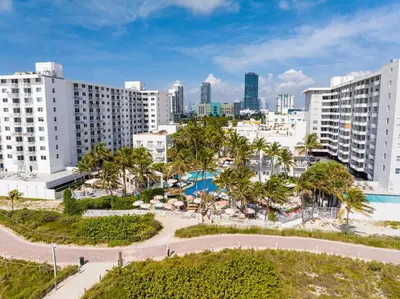 an aerial view of a city with tall buildings at The Savoy Hotel & Beach Club in Miami Beach