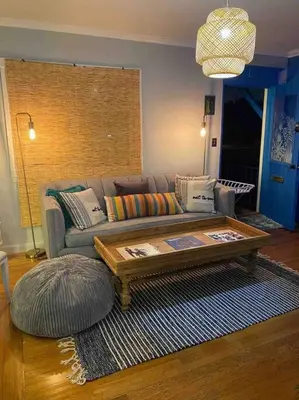 a living room with a couch and a coffee table at Cozy Cottage Near Beach in Hollywood