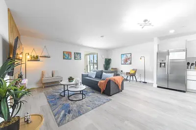 a living room with a couch and a table at Lofts of Aventura in Miami