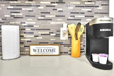 a welcome sign and utensils on a counter top at Boutique One Bdrm Close To Aventura Mall & Beach in Hallandale Beach