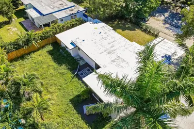 an overhead view of a building with palm trees at Mid-Century Modern Oasis in Miami