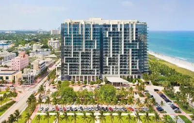 an aerial view of a large building next to the beach at Residences Suite South Beach in Miami Beach