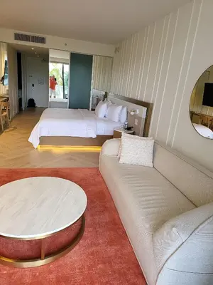 a living room with a couch and a bed at Residences Suite South Beach in Miami Beach