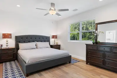 a bedroom with a bed and a ceiling fan at Las Olas Villa with HEATED Salt Water Pool in Fort Lauderdale