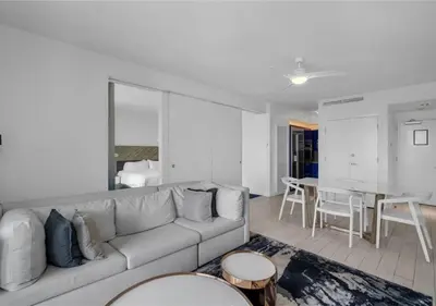 a living room with a couch and a dining room at Luxury 1 BR at Fort Lauderdale in Fort Lauderdale