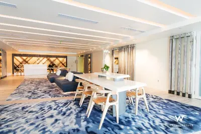a living room with a table and a couch at Luxury 1 BR at Fort Lauderdale in Fort Lauderdale