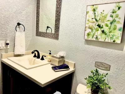 a bathroom with a sink and a mirror at 3 Bed - Sleeps 6 - Free Parking - 5 Mins to Beach in Hollywood