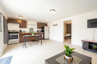 an open kitchen and living room with a table at COZY Private Apts in Hollywood By Hard Rock Casino! in Hollywood