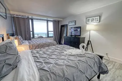 a bedroom with a bed with a swan on it at Deluxe Apartments by South Florida Vacations in Miami Beach
