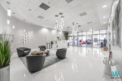 a lobby with chairs and a table in a building at Amazing 3BR Condo at Brickell with City Views in Miami