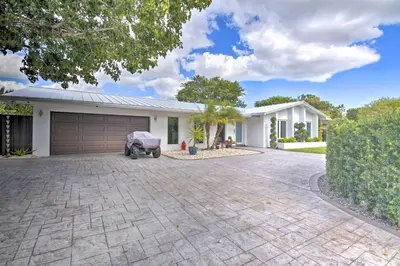 a house with a driveway and a garage at Miami Home Outdoor Pool with Slide and Fire Pit! in Kendall