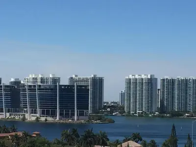 a city with tall buildings and a body of water at DISFRUTA SUNNY ISLES OCEAn 1206 STR-02816 in Miami Beach