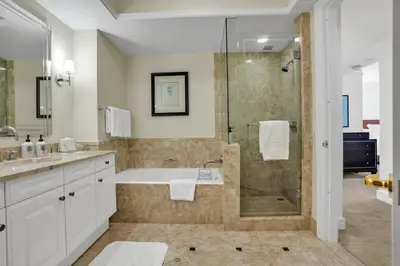 a bathroom with a shower and a sink and a tub at 2 Bedroom OR King Studio Suites Four Seasons Hotel Miami Free Wi-Fi & Free Parking in Miami