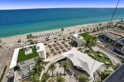 a view of a beach and the ocean from a building at 1BR condo w hot tub gym access in Fort Lauderdale