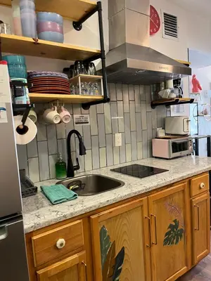 a kitchen with a sink and a counter top at Stunning Little Havana Suites Close to airport, Calle Ocho, Brickell, Wynwood and the Beaches - Free Parking in Miami
