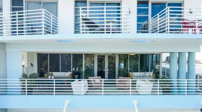 a building with a pool in front of it at Boutique Suite with Huge Terrace and Rooftop Pool in Miami Beach
