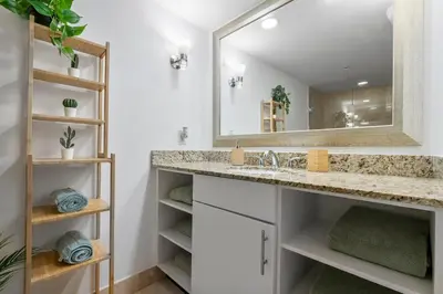 a bathroom with a sink and a mirror at Avi Lux Stay in Fort Lauderdale