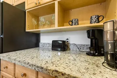 a kitchen with a counter top with a coffee maker on it at CocoBay 2BR Condos Near Beach, Galleria Mall, Wilton Manors, Cruise Port in Fort Lauderdale
