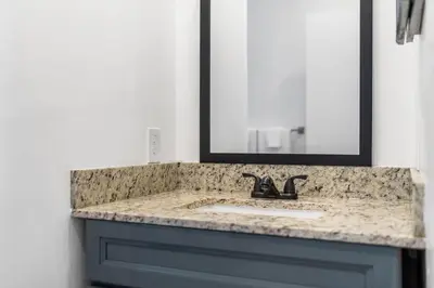 a bathroom with a sink and a mirror at CocoBay 2BR Condos Near Beach, Galleria Mall, Wilton Manors, Cruise Port in Fort Lauderdale