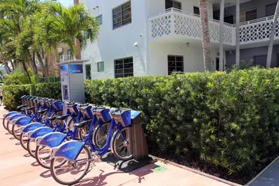 a row of blue bikes parked in front of a building at Hotel Gaythering - Gay Hotel - All Adults Welcome in Miami Beach