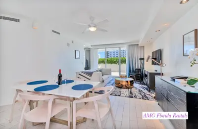 a kitchen and living room with a table and chairs at Stylish 1 BR at Fort Lauderdale in Fort Lauderdale