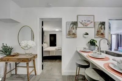 a bathroom with a sink and a counter with a mirror at Casa Del Sol in Hollywood