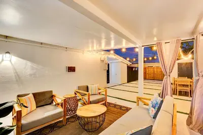 a living room with a couch and chairs and a table at Casa Del Sol in Hollywood