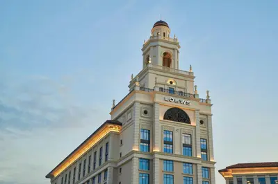 a building with a tower on top of it at Loews Coral Gables Hotel in Miami