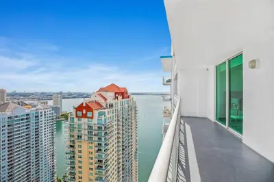 a balcony with a view of the water and buildings at Amazing Penthouse In beautiful Brickell 42 floor!! Free Garage Parking in Miami