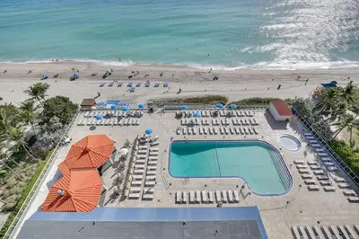 an overhead view of a pool and the beach at Sunny Isles Beach Retreat with Resort Perks! in Miami Beach