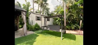 a hammock in a yard with grass at HEART OF WILTON MANORS in Fort Lauderdale