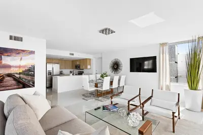 a living room with a couch and a table at Bay Harbor One Vacation in Miami Beach