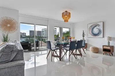 a living room with a dining room table and chairs at Bay Harbor One Vacation in Miami Beach