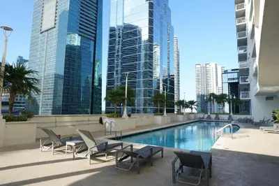 a swimming pool in a city with tall buildings at 4 bed full condo in Miami with skyline & sea view in Miami