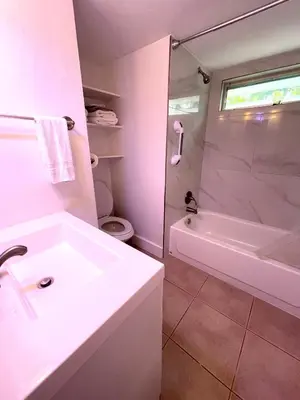 a bathroom with a white sink and a shower at Downtown FTL apartments on the River in Fort Lauderdale