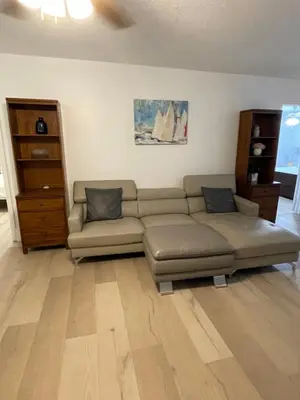 a living room with a couch and a table at Cozy Downtown Apartments on Water in Fort Lauderdale