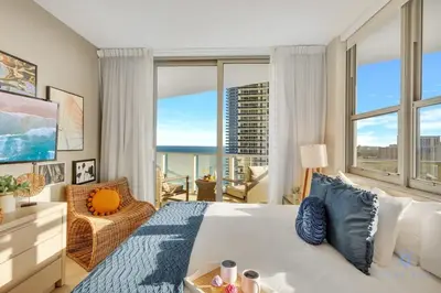a bedroom with a large bed and a large window at Insane Ocean View Balcony - Beachfront Resort - Pools in Hollywood