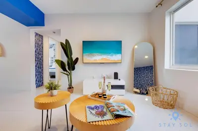 a living room with a table and two chairs at Free Parking - Bay View - Pool - Step To Beach in Hollywood