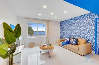 a living room with a couch and a table at Free Parking - Bay View - Pool - Step To Beach in Hollywood