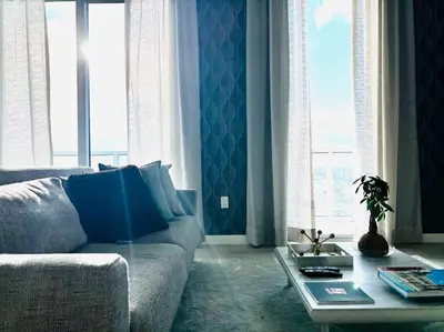 a living room with a couch and a table at BRAND NEW TOP FLOOR IN THE HEART OF MIAMI in Miami