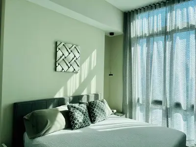 a bedroom with a bed and a window at BRAND NEW TOP FLOOR IN THE HEART OF MIAMI in Miami