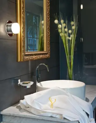 a bathroom with a sink and a bath tub at Leslie Hotel Ocean Drive in Miami Beach