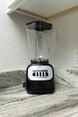 a blender sitting on top of a table at The Hideaway at Lake Ridge 1 in Fort Lauderdale