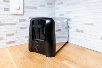 a black suitcase sitting on the floor of a room at The Palms at Middle River Terrace 3 in Fort Lauderdale