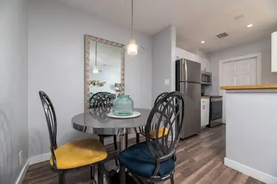 a kitchen and dining room with a table and chairs at The Palms at Middle River Terrace 3 in Fort Lauderdale