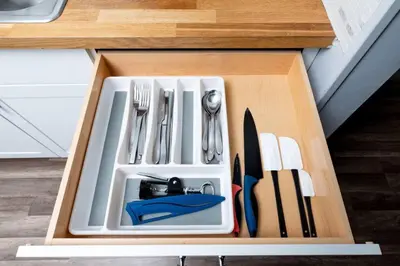a drawer filled with utensils in a kitchen at The Palms at Middle River Terrace 2 in Fort Lauderdale