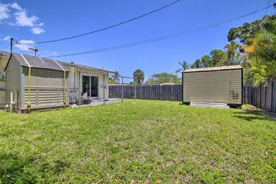 a yard with two buildings and a fence at Fort Lauderdale Duplex about 5 Mi to Downtown! in Fort Lauderdale